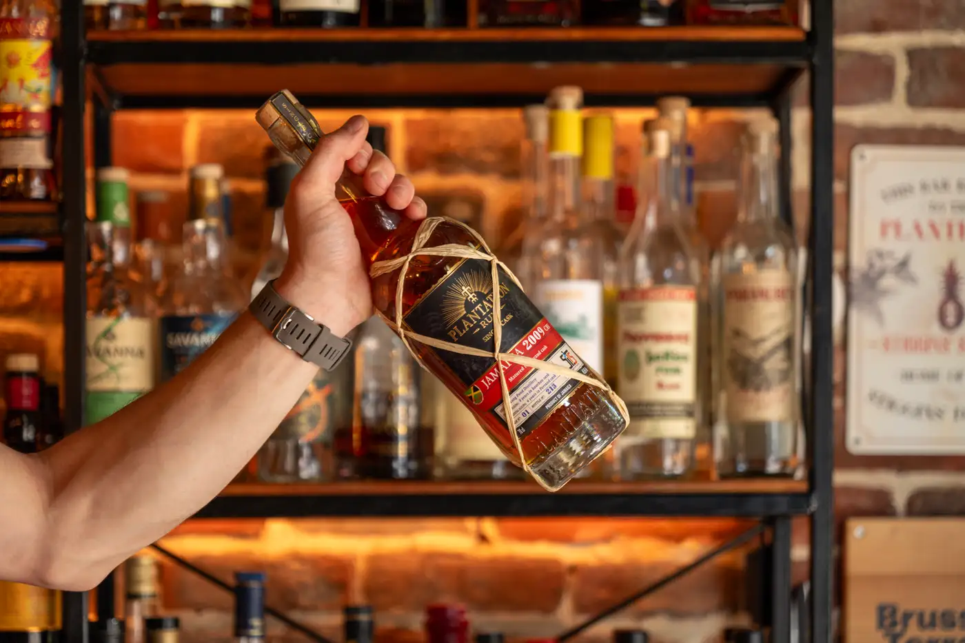 A single cask rum handed over the counter at the bar