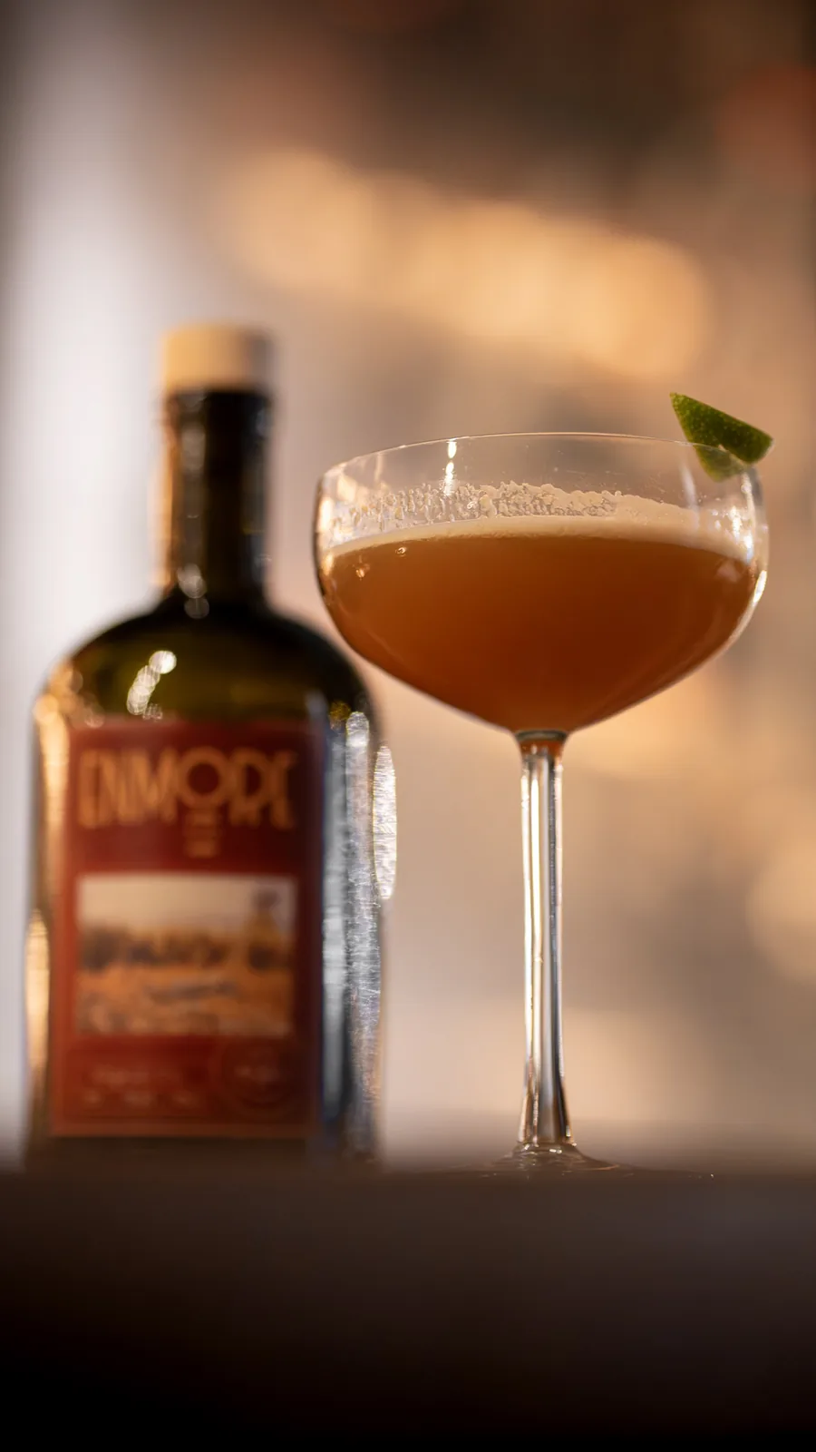 A Scandalequiri — a Daiquiri built on a rare Enmore 1991 Demerara rum — in a coupe beside its bottle at The Modern Alchemist, Brussels